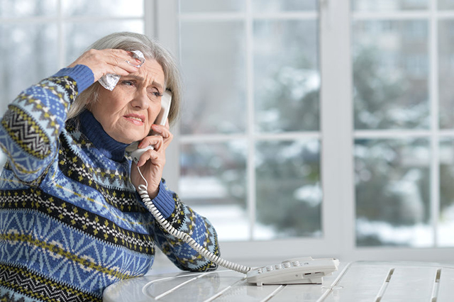 seniot lady distressed on the phone